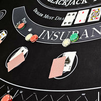 Blackjack neoprene table mat with cards and chips.