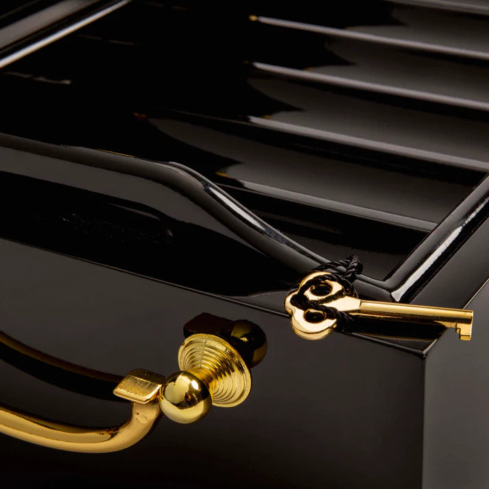 Black mahogany wood poker case opened corner view closeup with key shown.