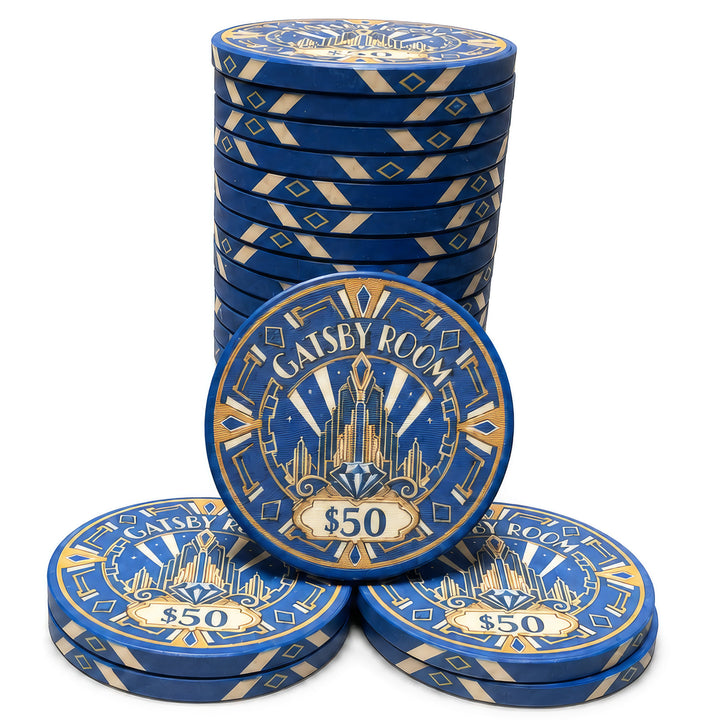 A set of blue and gold casino-style ceramic poker chips stacked and arranged on a white background. The front pieces show the text 'GATSBY ROOM' and '$50' with an Art Deco building design, and the stack shows repeating blue and gold geometric borders.