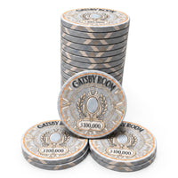 A set of Gatsby Room casino-style ceramic poker chips with a $100,000 denomination, arranged with three stacked coins in the back, one large chip in the front, and two chips on the side, all on a clean white background.