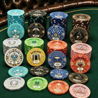 A collection of stacked Gatsby Room casino ceramic poker chips in multiple colors and denominations arranged on a green felt table with a brown leather chair visible in the background.