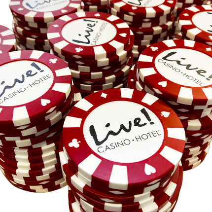 Stacks of red and white giant poker chip coasters with 'Live! Casino Hotel' branding.