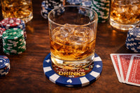 Glass of whiskey with ice on a poker-themed coaster surrounded by poker chips and cards.