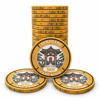 Three stacks of gold-colored Senjutsu card room 50¢ ceramic poker chips with a central illustration of a temple gate and red sun disc, displayed on a clean white background.