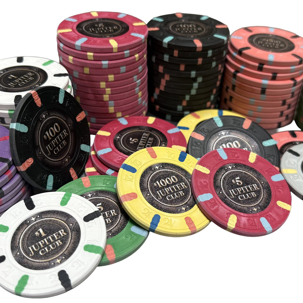 Assorted Jupiter 43mm real clay poker chips with different colors and values on a white background