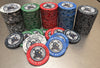 Set of custom ceramic poker chips, marbled series template, with "Ore House Poker Brothel's" branding on our stainless steel production table.